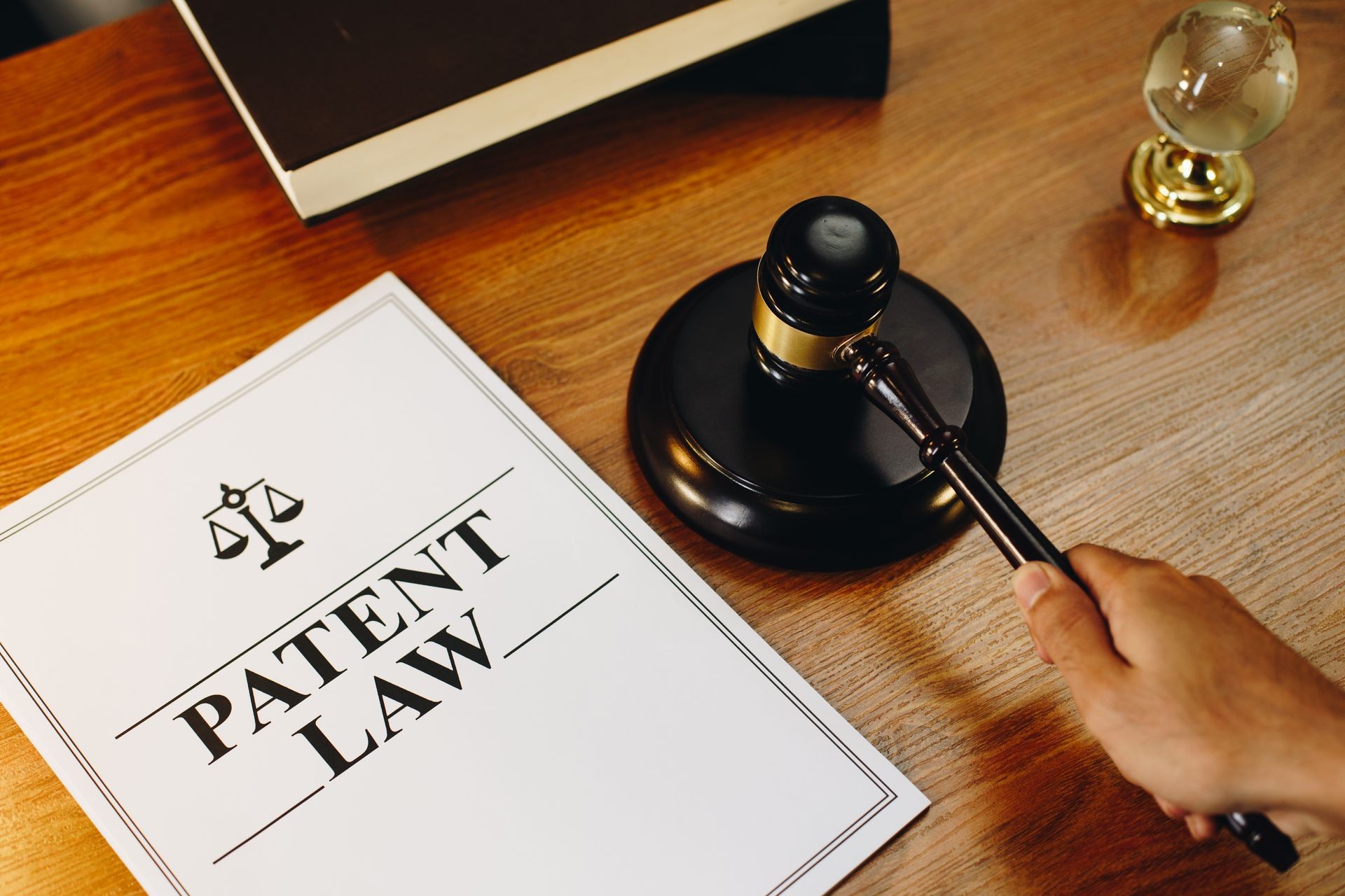 Patent Law legal documents with gavel at the side